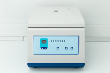Closeup of white medical equipment in dentist cabinet