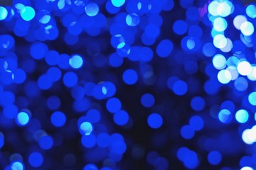 Colored lights of garlands on a blurred background. Bokeh