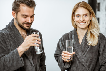 Man and woman with mineral water at the pump-room