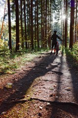 Girl and bike in the forest 