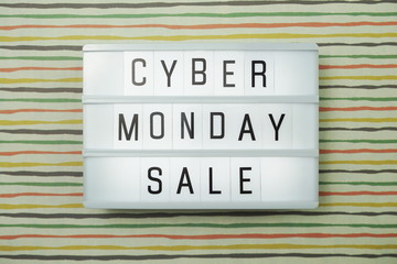 Cyber Monday Sale word in Light box with space copy Flat lay