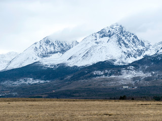 Fototapeta premium cloudy day, snowy mountain peaks, cold winter day, Tatra Mountains, Slovakia