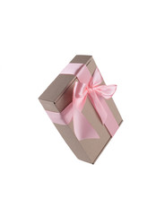 Festive box on white background with pink ribbon