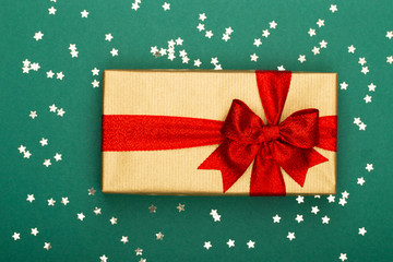 Christmas composition. Christmas golden glittering decorations on color background. Flat lay, top view, copy space - Image