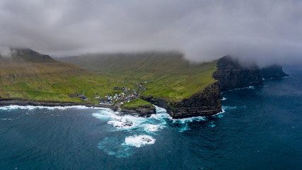 Fototapeta na wymiar Natural harbour gorge in Gjogv village aerial view, Faroe Islands
