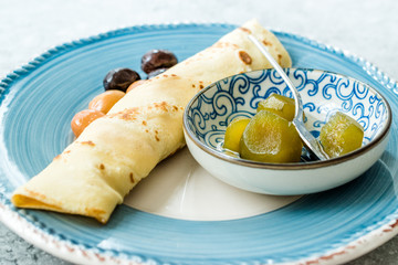 Plain Wrapped Crepe with Fig Jam, and Olives for Breakfast