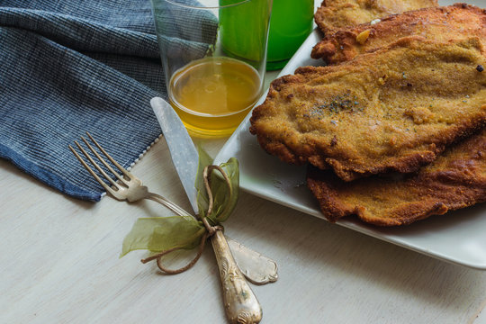 traditional cachopo and sidra, tasty meal from Asturias, Spain