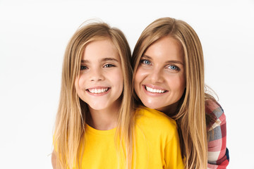 Photo of lovely caucasian family mother and daughter smiling and hugging together at camera