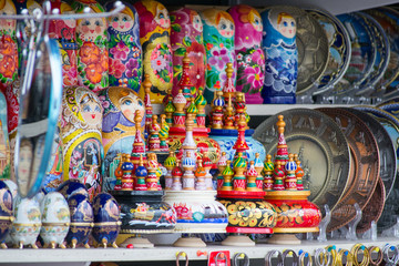 Detail of some souvenirs from Russia, found in a outdoor market in Saint Petersburg. There are colorful matryoshkas, plates and eggs