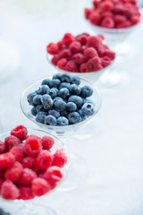 Fresh summer raspberry fruits on table