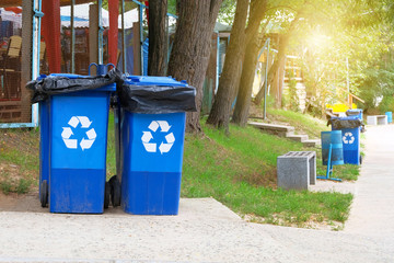 Garbage collection. Blue containers for further processing of garbage.  Waste recycling concept....