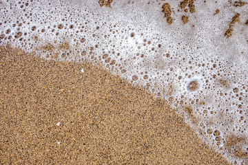 Fototapeta na wymiar Sea wave on sandy beach