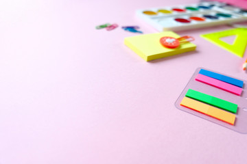 Back to school. The various stationery on light pink background.