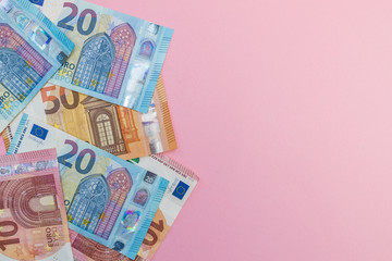 Euro currency cash bank notes money pink background