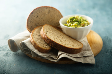 Homemade rye bread with avocado dip