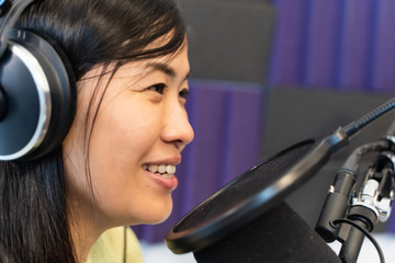 Asian female life playing the music and talk On Air Broadcasts.