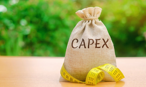 Money bag with the word Capex ( capital expenditure ) and tape measure. Capital used by companies to acquire or upgrade physical assets. Business management concept