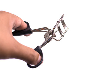 The eyelash curler is used with a black handle.
