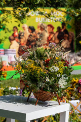 Fototapeta na wymiar Floristic bouquet of flowers, herbs and fruits that are the symbol of summer