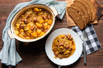 Meat stew with potato and cabbage, top view