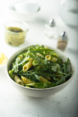Pasta salad with pesto and arugula