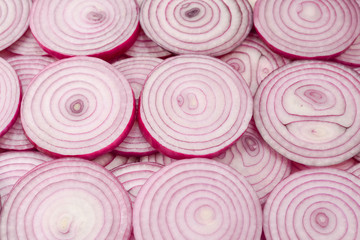 Onion slices as a background. Top view.