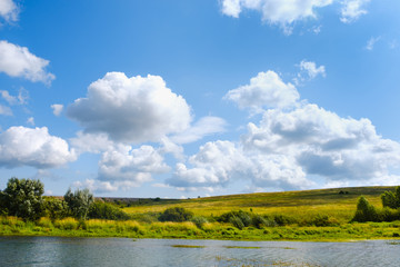 Russian open spaces. Pole. River. Sky. The clouds. Summer Russian landscapes. Road views. Summer landscape background