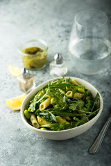 Pasta salad with pesto and arugula