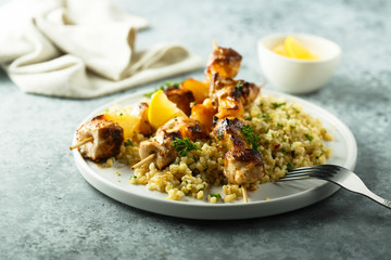 Homemade chicken skewers with bulgur and herbs