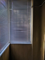 blinds on the balcony of the office apartment, the blinds are closed.