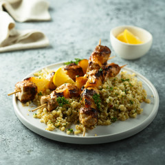Homemade chicken skewers with bulgur and herbs