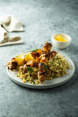 Homemade chicken skewers with bulgur and herbs