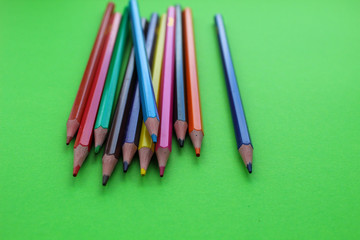 Drawings with colored pencils on a green background