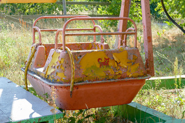 Old abandoned carousel. Sunny summer day. 