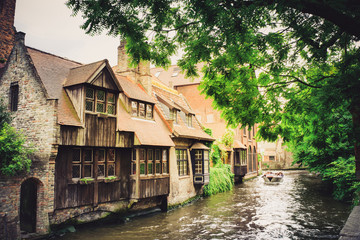 Fototapeta premium Old houses by the canal in Bruges