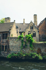 Fototapeta premium Old houses by the canal in Bruges