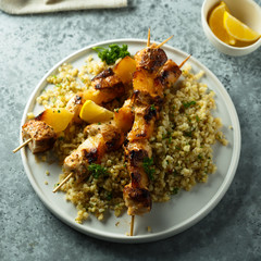Homemade chicken skewers with bulgur and herbs