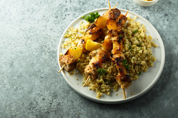Homemade chicken skewers with bulgur and herbs