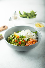 Rice bowl with smoked salmon and avocado