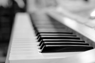 a synthesizer keyboard close up, soft focus