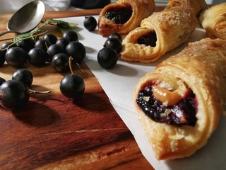 Biscuits with black currant filling on the table.