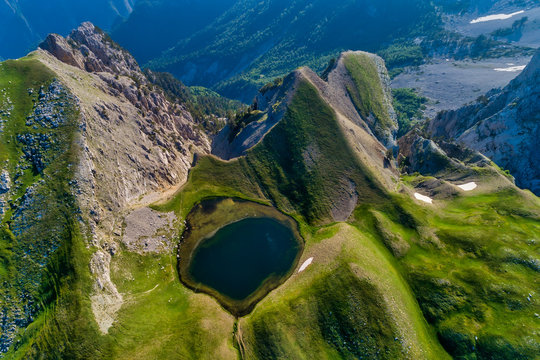 Drakolimni of Tymfi. The lake resides at an altitude of 2050m above sea, in Vikos National Park in Greece. At 5 hours walking distance from the village of Papingo, is a popular trekking destination