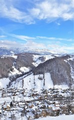 landscape with Cheia village and Bucegi mountains in winter