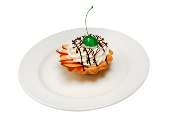 Delicious cupcake on a plate on a white isolated background