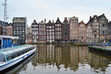 Naklejka premium View on the crooked houses of Amsterdam from a canal, Netherlands