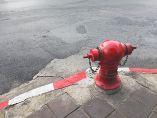 red fire hydrant on road in city