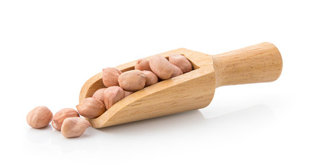 peanuts in wood scoop isolated on white background