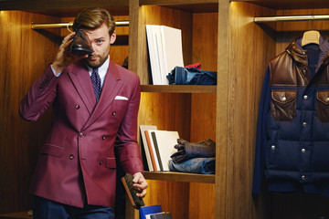 Smart business male in trendy showroom - 285050248