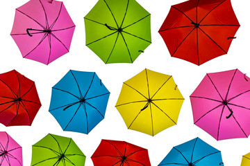 Fototapeta na wymiar Many colorful umbrella isolated on white background . Street decoration of bright multi-colored umbrellas.