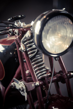 Front suspension of a red vintage motorcycle